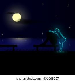 Sad man sitting on the bench of the beach at night and misses his mother.