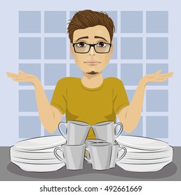 sad man throws up his hands because of dirty dishes pile needing washing up