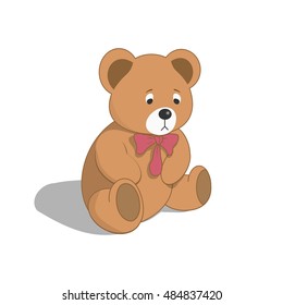 sad teddy bear with a bow at the neck isolated on white background