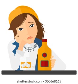 Sad woman with bottle and glass.