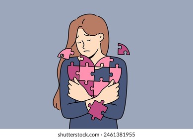 Sad woman holds disintegrating heart, symbolizing restoration of psyche after breaking up with guy. Girl with heart from puzzle, for concept of oncological diseases and cardio organ cancer