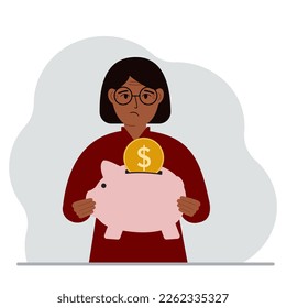 Sad woman holds a piggy bank, a coin falls into the piggy bank. The concept of saving finance, savings, investing finances. Vector flat illustration