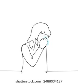 sad woman stands with her head bowed and wipes her tears with a handkerchief - one line art vector. concept quietly crying female tears, sensitive, allergy, conjunctivitis. Handmade vector not AI