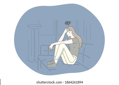 Sadness, mental depression, bad news concept. Young unhappy woman sitting on sofa touching forehead feeling depressed with thoughts after negative events, crying, suffering from loneliness 