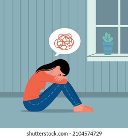 Sadness, mental depression, bad news concept. Young unhappy woman sitting on the floor at home, hugging knees hands, feeling depressed by thoughts after negative events, crying, suffering