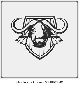 Safari emblem with buffalo. Vector monochrome illustration.