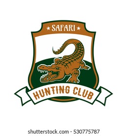 Safari Hunting club emblem. Vector isolated shield shape icon or badge with African crocodile alligator in river and ribbon. Hunting sport adventure club symbol or icon.