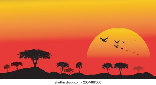 Safari.Flock of birds flying in the sky ,on a beautiful sunset background.amazing scenery.Sunset and sunrise.