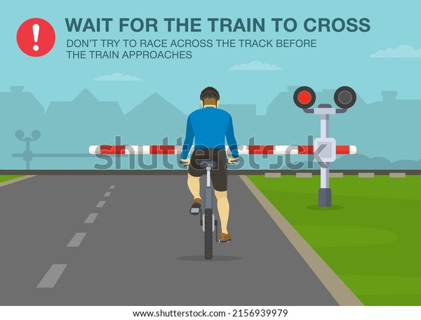 Safe bicycle riding\
rules and tips. Wait for the train to cross, don\'t try to race\
across the track before the train approaches. Back view of a\
cyclist at railroad\
crossing.