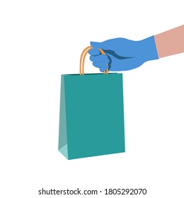 Safe delivery concept. Human hand in gloves holding bag with products. Stay home and order food or goods by courier service delivery. Isolation, coronavirus quarantine, protection. Vector illustration
