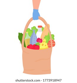 Safe delivery. Hands in protective gloves are holding an eco bag with food. Protection against coronavirus COVID-19.