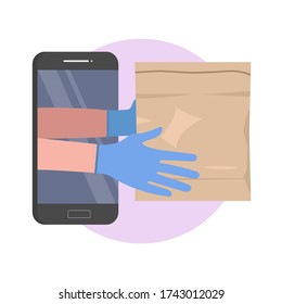 Safe food delivery. delivering grocery order to the home of customer with medical gloves during the coronavirus pandemic lockdown. Coronavirus epidemic. A courier hands holds craft paper package 
