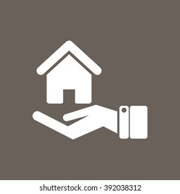 Safe & Protected home in Hand Icon on Dark Gray Color. Eps-10.