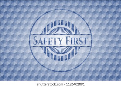 Safety First blue hexagon emblem.