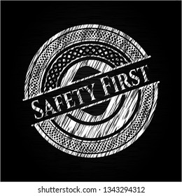Safety First chalk emblem written on a blackboard