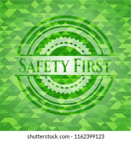 Safety First green emblem with triangle mosaic background