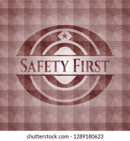 Safety First red seamless emblem or badge with geometric pattern background.