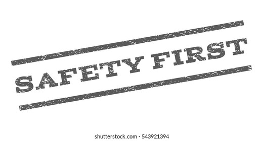 Safety First watermark stamp. Text caption between parallel lines with grunge design style. Rubber seal stamp with scratched texture. Vector grey color ink imprint on a white background.