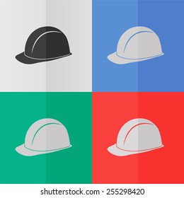 Safety hard hat vector icon. Effect of folded paper. Colored (red, blue, green) illustrations. Flat design
