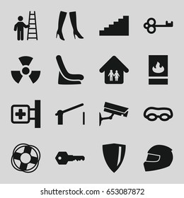 Safety icons set. set of 16 safety filled icons such as baby seat in car, woman boots, medical cross, family home, key, barrier, fire protection, helmet, lifebuoy