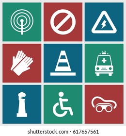 Safety icons set. set of 9 safety filled icons such as lighthouse, gloves, cone, welding glasses, disabled, prohibited, ambulance, voltage warning