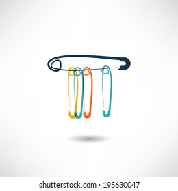 Safety pins isolated on the white background