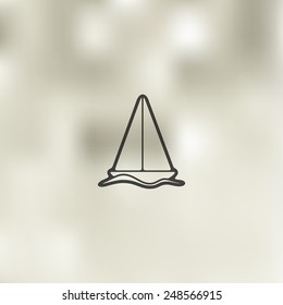 sailboat icon on blurred background