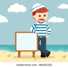 sailor standing beside sign