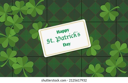 Saint Patrick´s day background, greeting card with green paper cut cloves and rhombuses tiles background