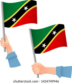 Saint Kitts and Nevis flag in hand. Patriotic background. National flag of Saint Kitts and Nevis vector illustration
