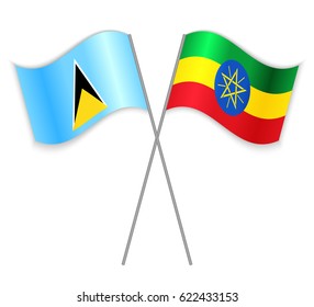 Saint Lucian and Ethiopian crossed flags. Saint Lucia combined with Ethiopia isolated on white. Language learning, international business or travel concept.