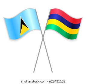 Saint Lucian and Mauritian crossed flags. Saint Lucia combined with Mauritius isolated on white. Language learning, international business or travel concept.