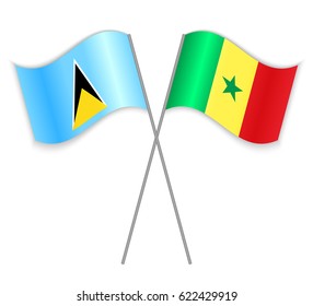 Saint Lucian and Senegalese crossed flags. Saint Lucia combined with Senegal isolated on white. Language learning, international business or travel concept.