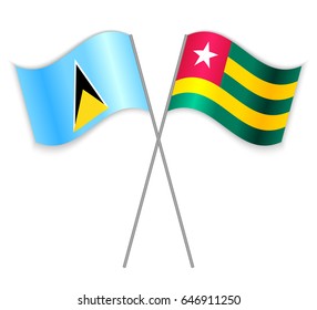 Saint Lucian and Togolese crossed flags. Saint Lucia combined with Togo isolated on white. Language learning, international business or travel concept.