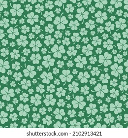 Saint Patrick s Day seamless pattern with clover leaves and green background. Stylish spring or summer print for wrapping paper, fabric, web design. Vector flat design illustration