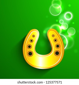 Saint Patrick's Day background or greeting card with golden horseshoe on green background. EPS 10.