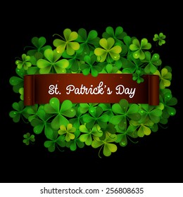 Saint Patricks Day card, ribbon on realistic shamrock leaves