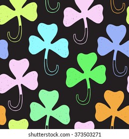 Saint Patrick's day colorful background. Seamless vector clover shamrock pattern. Hand drawn.