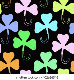Saint Patrick's day colorful background. Seamless vector clover shamrock pattern. Hand drawn.