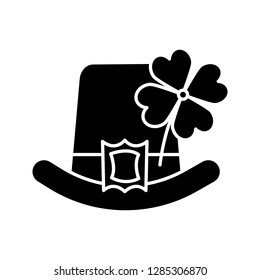 Saint Patrick's Day glyph icon. March 17th. Leprechaun hat with four leaf clover. Silhouette symbol. Negative space. Vector isolated illustration