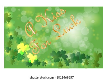 Saint Patrick's Day greeting card with sparkled green clover leaves and text. Inscription - A Kiss For Luck