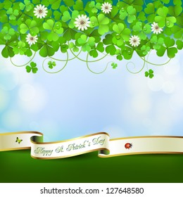 Saint Patrick's Day greeting card with clover and ribbon