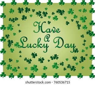 Saint Patrick's Day greeting card with sparkled green clover leaves and text. Inscription - Have A Lucky Day
