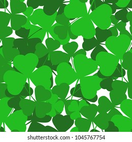 Saint Patrick's day seamless background with green shamrock leaves. Vector Illustration