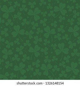 Saint Patrick's day seamless background in dark green with cloverleafs and stars. Shamrock irish background. For web, textile, wrapping paper, wallpaper, banner, card. Vector illustration.