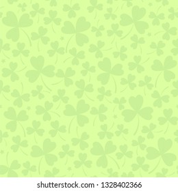 Saint Patrick's day seamless background in light green with cloverleafs and stars. Shamrock irish background. For web, textile, wrapping paper, wallpaper, banner, card. Vector illustration.