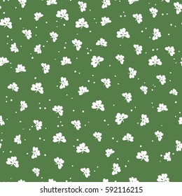 Saint Patrick's Day seamless pattern. Clover leaf and golden dots. Abstract holiday background 