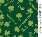 Saint Patricks day shamrock seamless pattern. Seamless pattern of green clover leaves on a dark green background. Vector seamless background St. Patrick