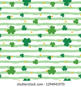 Saint Patrick's Day striped seamless pattern background with green clover, shamrock and dots.