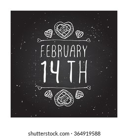 Saint Valentine's day greeting card.  February 14th. Typographic banner with text and doodle heart shaped cookies on chalkboard background.